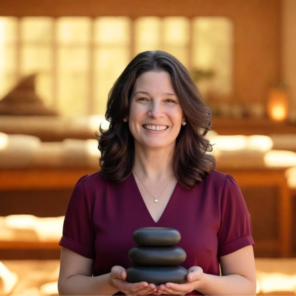 Instructor holding a stack of massage stones